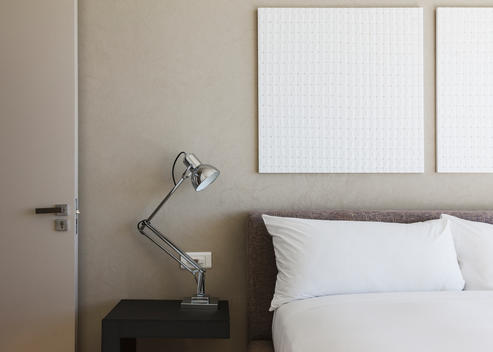 Lamp and wall art in modern bedroom