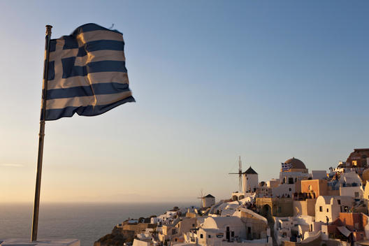 Greece, Cyclades, Thira, Santorini, Greek flag and the town