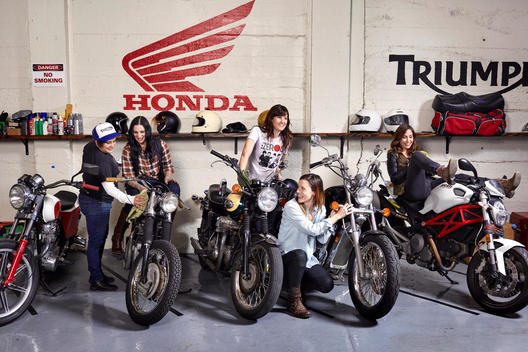 Members of the MissFires all female motorcycle club in a garage in Brooklyn