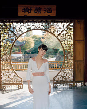 Woman Standing In A Zen Temple