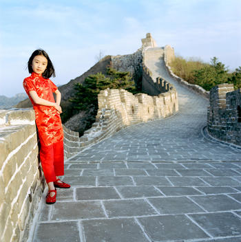 Chinese girl in traditional clothes at the great wall