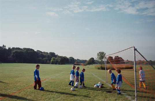 A Group Of Kids Practice Before A Soccer Match In A Youth Soccer League.
