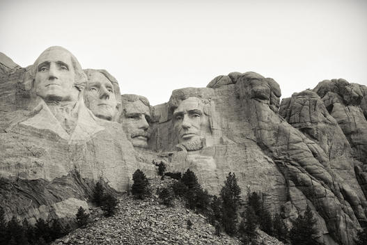the statues of George Washington, Thomas Jefferson, Teddy Roosevelt and Abraham Lincoln are shown at Mount Rushmore in South Dakota