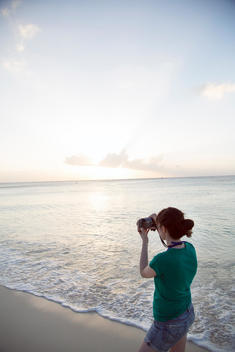 Taking a picture at dusk, Seven Mile Beach, Grand Cayman Island