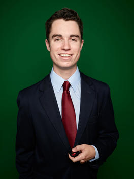 Weatherman Austin Winfield stands in front of a green screen at station KTVH