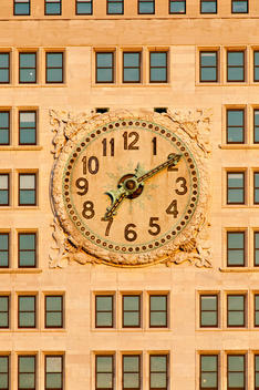 Clock On The Facade Of A Building In Midtown In The Late Afternoon. New York, New York.