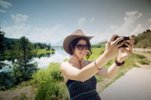 Girl taking a picture of herself with a Smartphone.