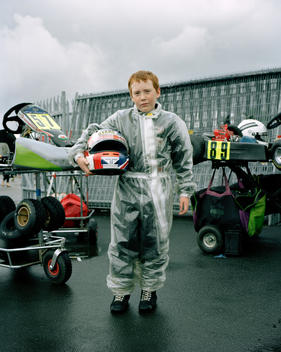 James Dehavillande (11) From Oxford Tries To Keep Dry Before The Finals Of The Cadets Race In The Msa British Short Circuit Kartmasters Grand Prix, Pf International Circuit, Trent Valley Kart Club.