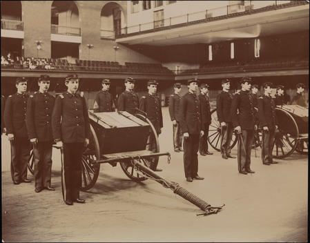 Male Students From The Berkeley School, In Uniform At A Military Drill In An Armory Or Auditorium.