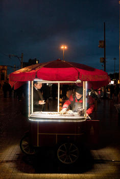 Man is selling food from his food cart on the street of Istanbul.