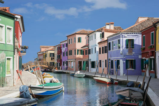 Pastel colored houses and boats on canal, Burano, Venice, Veneto, Italy