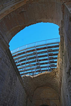 Low view of arch on the Amphitheatre of Arles. Historical monument, listed as World Heritage by UNESCO.