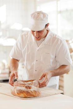 Baker With Circular Bread