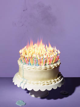 Birthday cake covered in melting candles