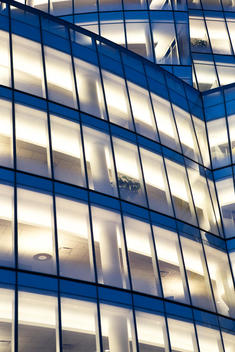 Detail of Modern office building illuminated at night by architect Frank Gehry in Manhattan
