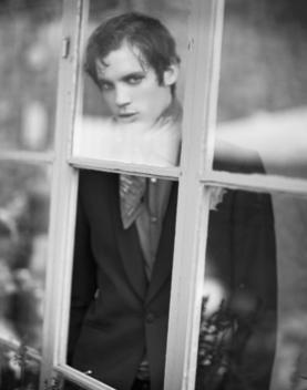 Attractive Well Dressed Man Seen Through A Window