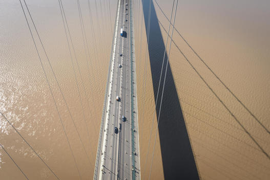 Overhead view of roadway on suspension bridge. The Humber Bridge, UK was built in 1981 and at the time was the world\'s largest single-span suspension bridge
