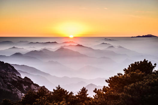 Fog rolling over rocky mountains, Huangshan, Anhui, China
