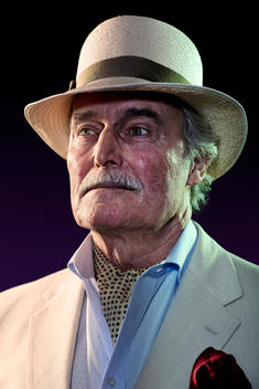 A Studio Portrait Of An Elderly Gentlemen Wearing A Panama Hat