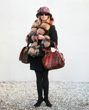Woman Wearing A Fur Trimmed Coat And Carrying Bags, Florence, Tuscany, Italy.
