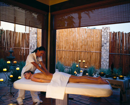 Woman Getting Outdoor Massage At Dusk
