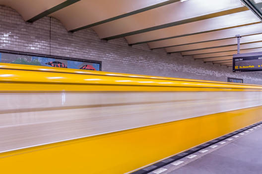 Germany, Berlin, subway station Deutsche Oper with moving underground train