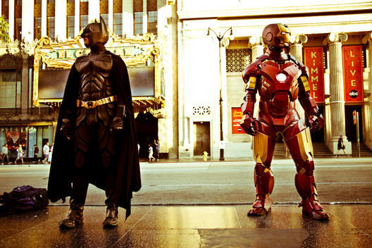 Street performers, doubles of Batman and Iron Man in Hollywood