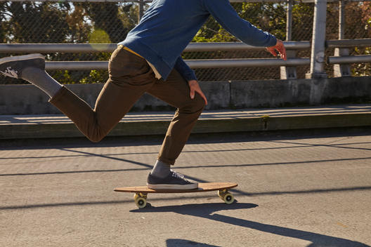 Man skateboarding in street.