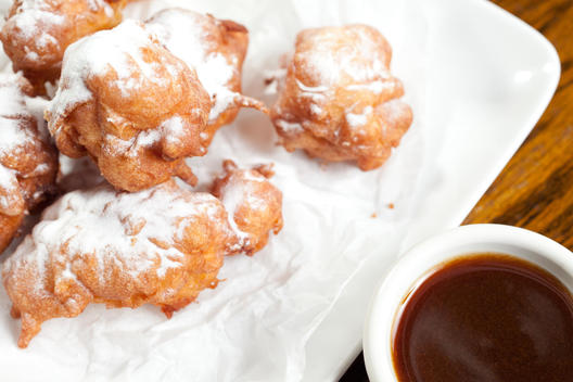 Apple Fritters With Powdered Sugar And Cider Dipping Sauce