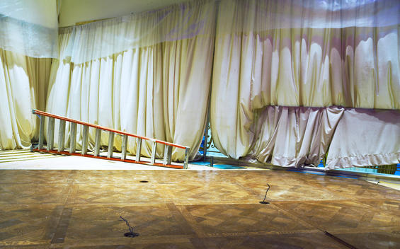 Parquet Floor Being Installed In Dance Floor With Billowing White Curtains