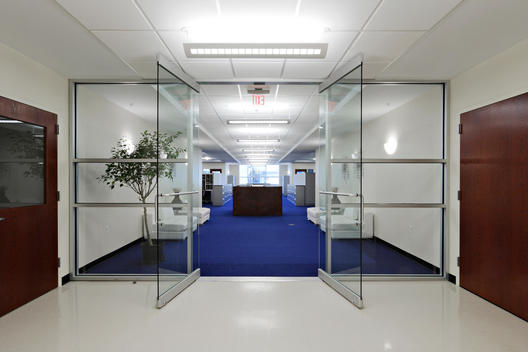 Glass Walled Entryway To Administrative Offices, Blue Carpet, White Furniture
