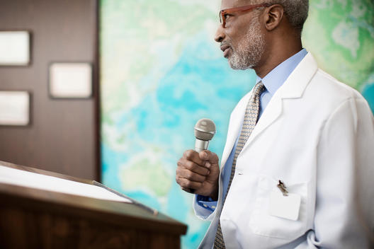 Black doctor giving presentation