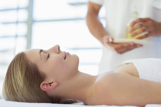 Woman receiving massage at spa