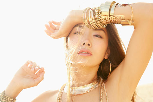 Japanese woman wearing gold bracelets