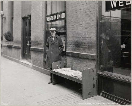 The Blind News Dealer, Frederick Rode And The Southeast Corner Of Broadway & 41St St. A Western Union Sign Is Visible In The Window Behind Mr. Rode.