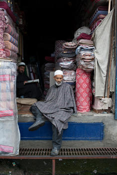 a portrait of a store owner in Srinagar