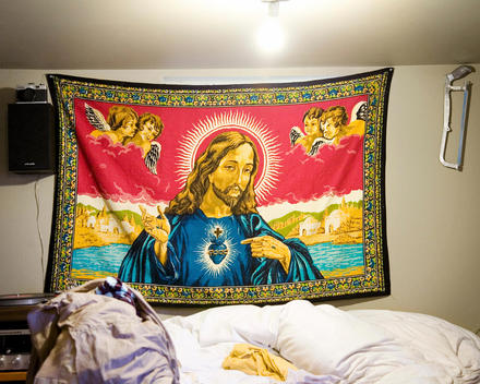 Jesus mural hanging in a bedroom