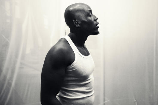 Beautiful black and white portrait of a black man with a white undershirt