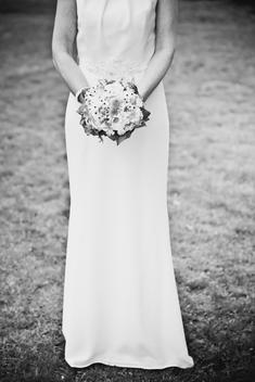 bride with bouquet, white and green flowers