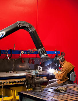 At Google an employee welds in a workshop that allows Google\'s to explore different hobbies recreationally
