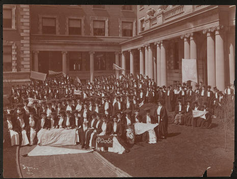 Crowd Of Students In A Courtyard At A Graduation Ceremony At Barnard College, New York.