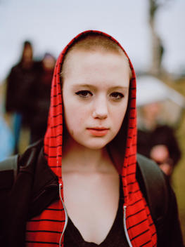 A young female protestor gathers outside the Halifax Regional Police Headquarters to demand justice for Rehtaeh Parsons at an event organized by the hacktivist group Anonymous. Halifax, Nova Scotia