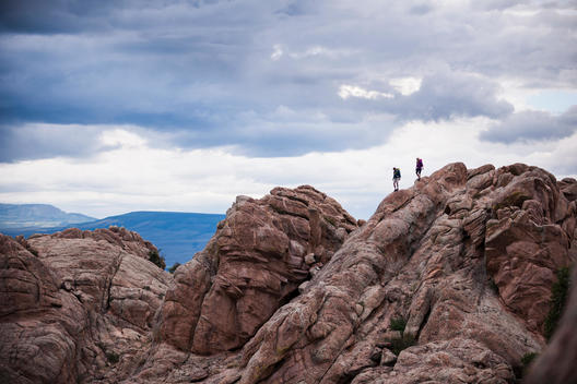 Couple on rocks, Hartman Rocks Recreation Area, Gunnison, Colorado, USA