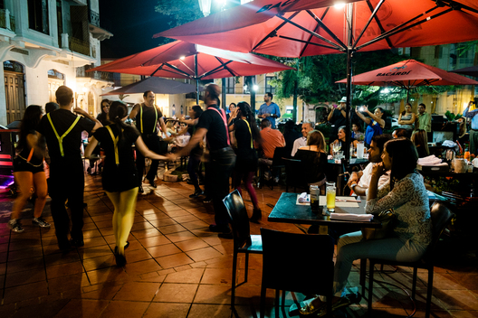 A Panamanian dance troupe dances for diners at an outdoor restaruant on Tomas Herrera Square next to the American Trade Hotel in the Casco Viejo neighborhood of Panama City, Panama.