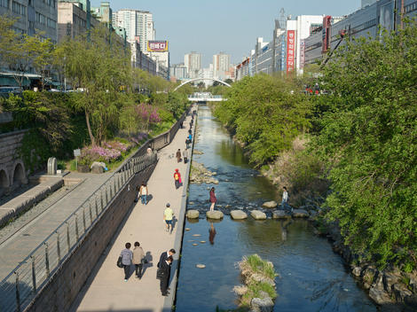 Cheonggyecheon Stream is a modern public recreation space in downtown Seoul. The massive urban renewal project is on the site of a stream that flowed before the rapid post-war economic development caused it to be covered by transportation infrastructure.