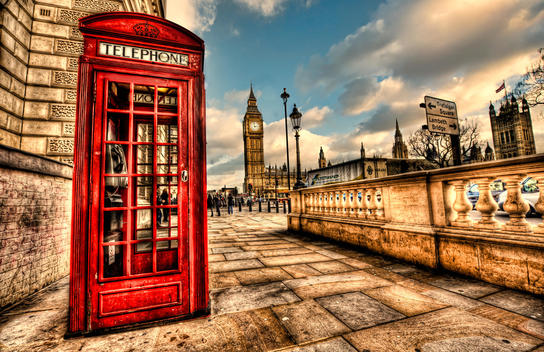 A Stereotypical London Scene Outside The Houses Of Parliament. A Red Telephone Box Stands Alone