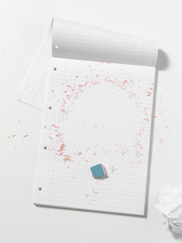 An A4 Plan Pad Where The Lines Have Been Rubbed Away By An Eraser To Leave A Blank Page.
