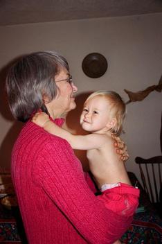 Woman And Granddaughter Hugging Playfully