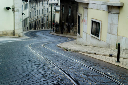 Tram Tracks Running Through An Empty City Street