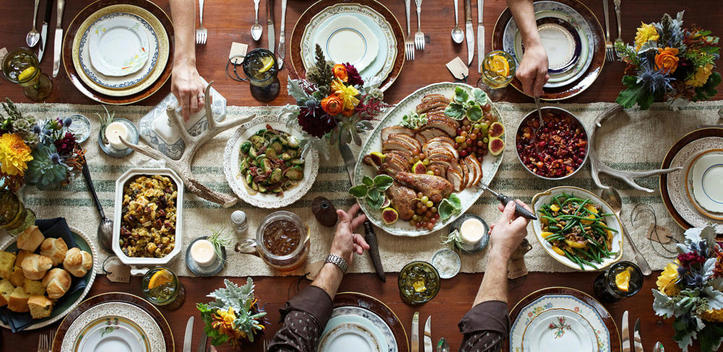 Aerial shot of a neatly set Thanksgiving dinner table.